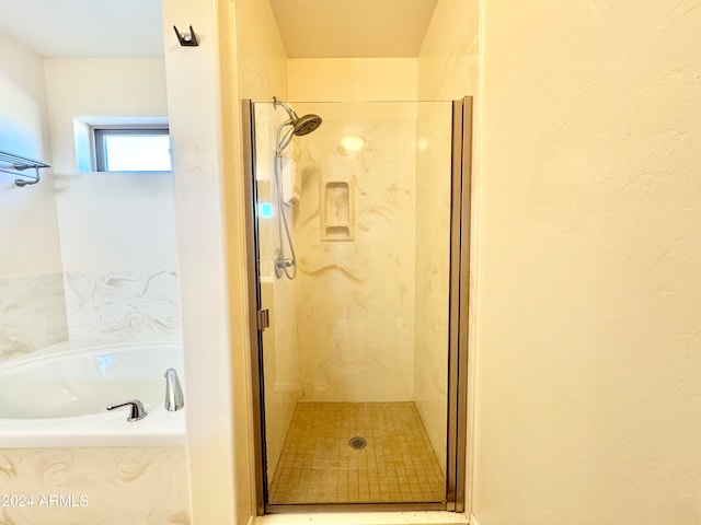 bathroom with independent shower and bath