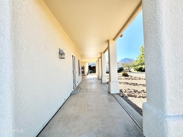 view of patio / terrace featuring a mountain view