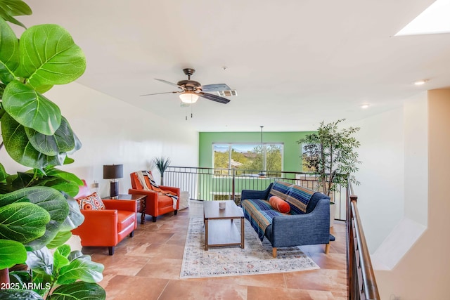 interior space with ceiling fan