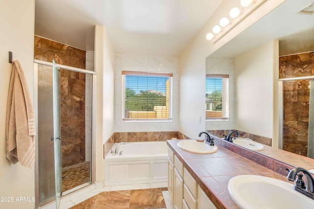 bathroom featuring plus walk in shower and vanity