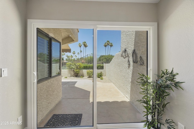 10538 E Gold Dust Cir, Scottsdale, AZ 85258 - doorway to outside with a textured wall