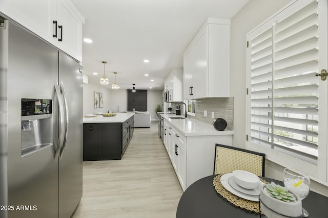 10538 E Gold Dust Cir, Scottsdale, AZ 85258 - kitchen featuring stainless steel appliances, light countertops, recessed lighting, and white cabinetry