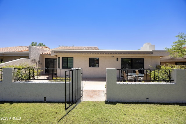 10538 E Gold Dust Cir, Scottsdale, AZ 85258 - back of house featuring stucco siding and a chimney