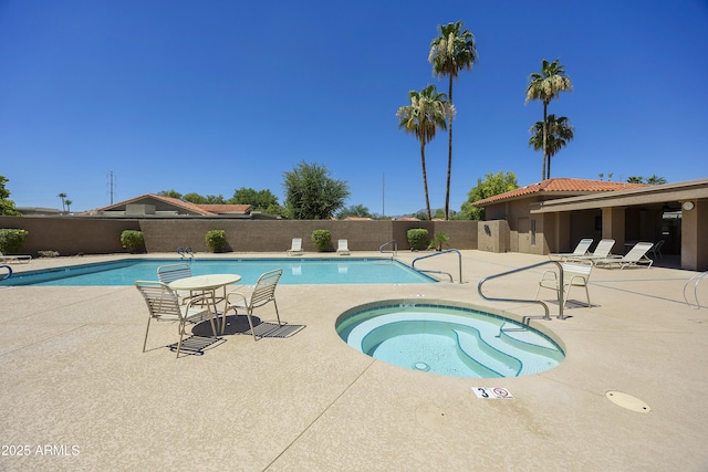 10538 E Gold Dust Cir, Scottsdale, AZ 85258 - community pool featuring a community hot tub, a patio, and a fenced backyard