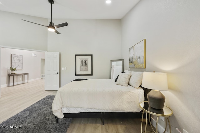 10538 E Gold Dust Cir, Scottsdale, AZ 85258 - bedroom with wood finished floors, a towering ceiling, and a ceiling fan