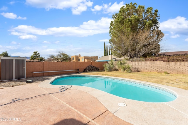 view of pool with a fenced in pool, a fenced backyard, and a patio