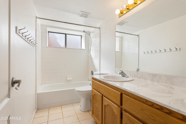 full bath with visible vents, toilet, vanity, tile patterned flooring, and shower / bathtub combination