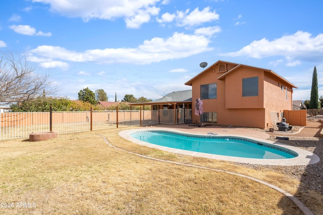 view of swimming pool with a patio area, a fenced backyard, and a fenced in pool