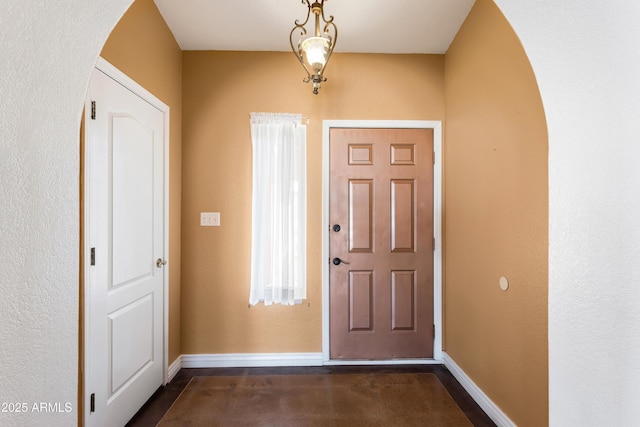 entrance foyer featuring baseboards