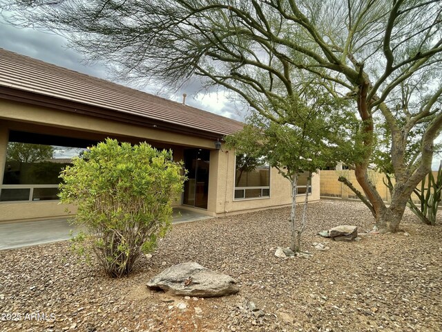 3421 W Warren Dr, Anthem, AZ 85086 - rear view of property with a tiled roof, stucco siding, fence, and a patio