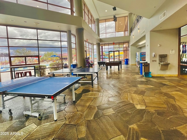 3421 W Warren Dr, Anthem, AZ 85086 - game room with stone floors, baseboards, a towering ceiling, visible vents, and pool table