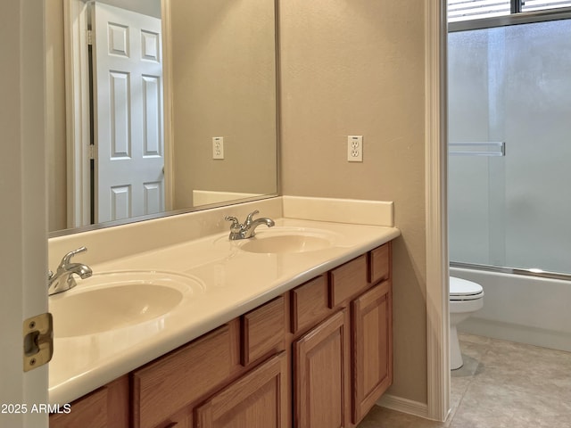 3421 W Warren Dr, Anthem, AZ 85086 - bathroom with double vanity, toilet, tile patterned flooring, and a sink