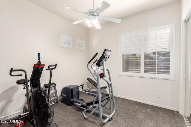 workout area featuring baseboards, ceiling fan, and dark colored carpet