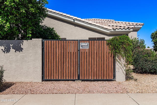 view of gate featuring fence