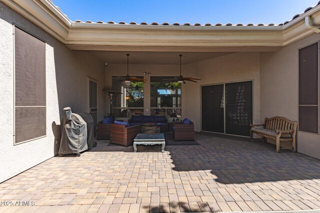 view of patio / terrace featuring a ceiling fan and an outdoor living space