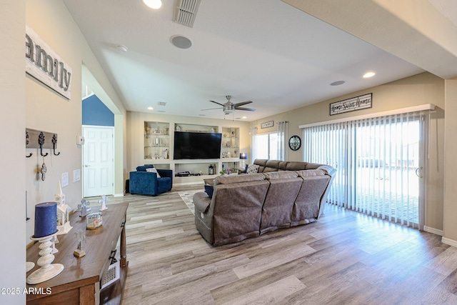 living area with visible vents, baseboards, ceiling fan, recessed lighting, and wood finished floors