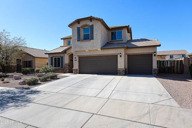 view of front of house with a tile roof, a garage, stone siding, and driveway