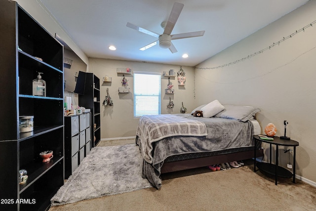 carpeted bedroom featuring baseboards and a ceiling fan