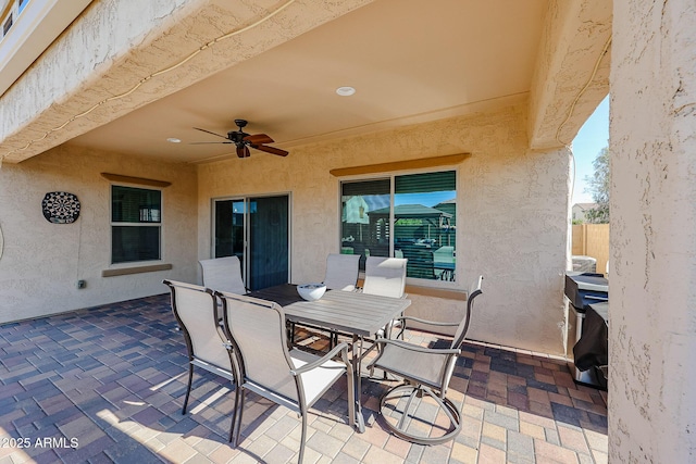 view of patio / terrace with outdoor dining area and ceiling fan
