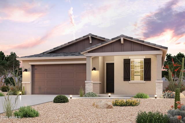 2614 E Music Mountain Ave, Apache Junction, AZ 85119 - view of front of home featuring driveway, a garage, stucco siding, covered porch, and board and batten siding