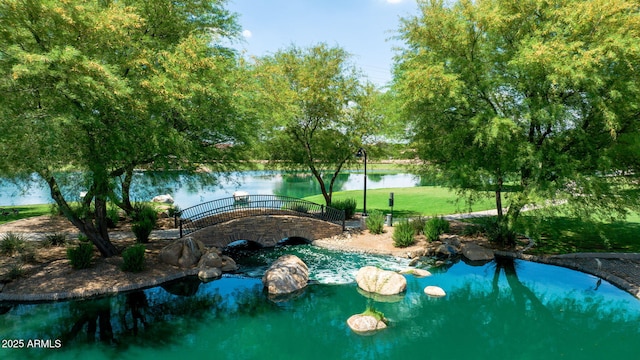 3400 S Whetstone Pl, Chandler, AZ 85286 - view of swimming pool featuring a lawn and a water view