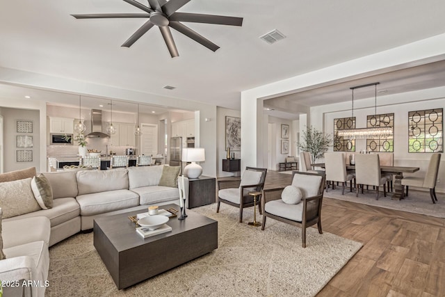 3400 S Whetstone Pl, Chandler, AZ 85286 - living area with ceiling fan and light wood-type flooring