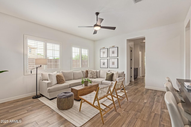 3400 S Whetstone Pl, Chandler, AZ 85286 - living area with ceiling fan, wood finished floors, and baseboards