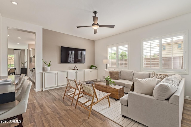 3400 S Whetstone Pl, Chandler, AZ 85286 - living room with light wood-style floors, a ceiling fan, recessed lighting, and baseboards