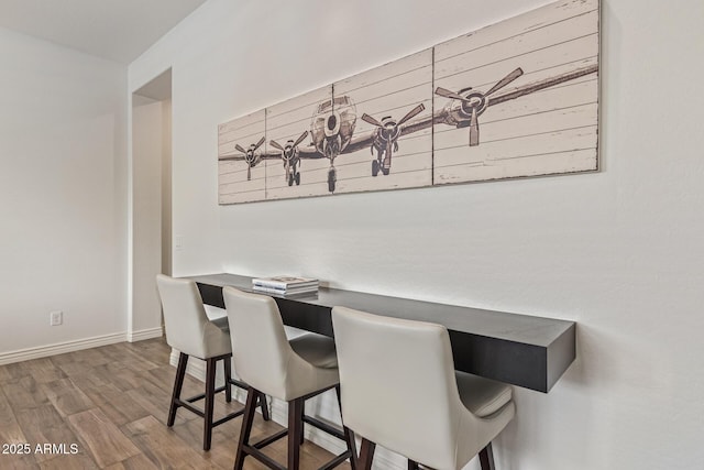 3400 S Whetstone Pl, Chandler, AZ 85286 - dining space with wood finished floors, baseboards, and an office area