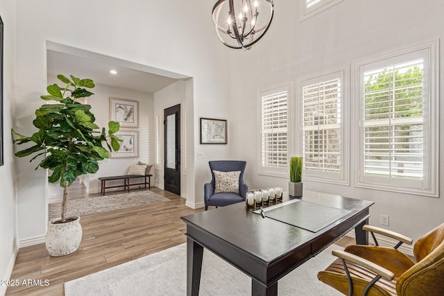 3400 S Whetstone Pl, Chandler, AZ 85286 - office with a chandelier, wood finished floors, baseboards, and a towering ceiling