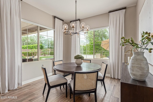 3400 S Whetstone Pl, Chandler, AZ 85286 - dining space featuring a chandelier, light wood finished floors, and baseboards