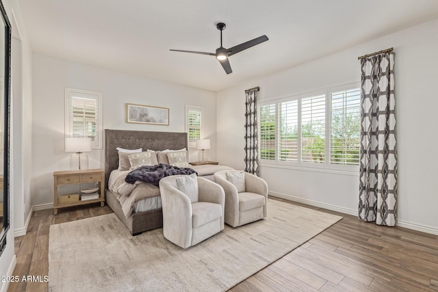 3400 S Whetstone Pl, Chandler, AZ 85286 - bedroom with wood finished floors, baseboards, and a ceiling fan