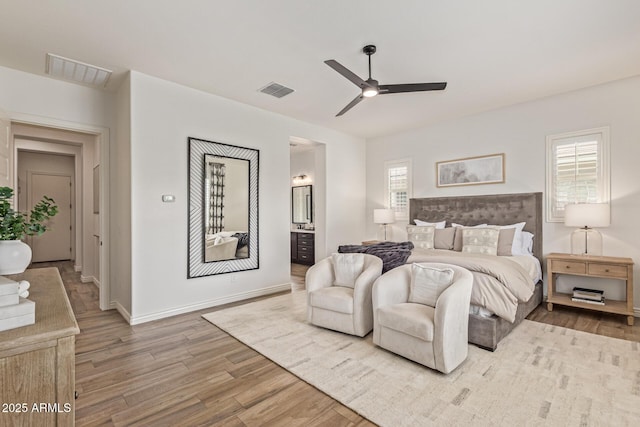 3400 S Whetstone Pl, Chandler, AZ 85286 - bedroom with wood finished floors, connected bathroom, a ceiling fan, and baseboards