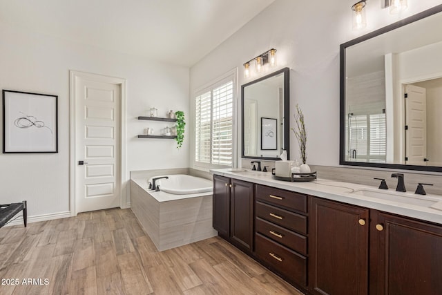 3400 S Whetstone Pl, Chandler, AZ 85286 - full bathroom with double vanity, a garden tub, wood finished floors, and an enclosed shower