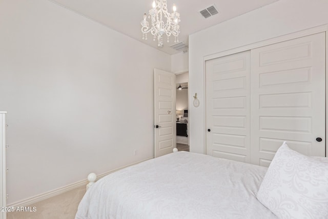 3400 S Whetstone Pl, Chandler, AZ 85286 - carpeted bedroom with a chandelier, a closet, and baseboards