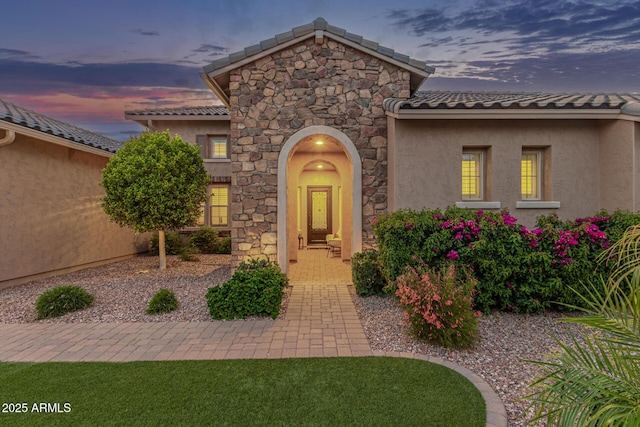 3400 S Whetstone Pl, Chandler, AZ 85286 - view of front of house with stone siding, stucco siding, and a tiled roof