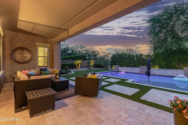 3400 S Whetstone Pl, Chandler, AZ 85286 - patio terrace at dusk featuring a patio area, outdoor lounge area, and a fenced backyard