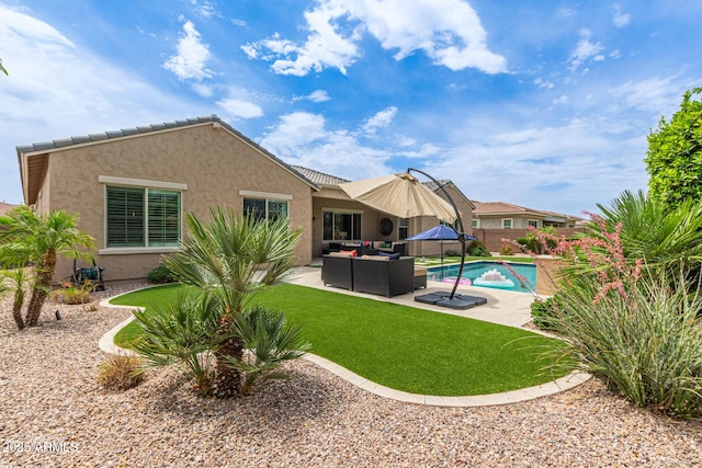 3400 S Whetstone Pl, Chandler, AZ 85286 - back of property with an outdoor hangout area, stucco siding, a patio area, and a lawn