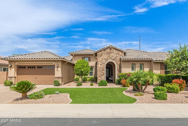 3400 S Whetstone Pl, Chandler, AZ 85286 - mediterranean / spanish home with stucco siding, stone siding, driveway, and an attached garage