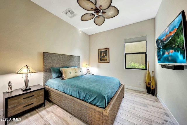 bedroom with ceiling fan and light wood-type flooring