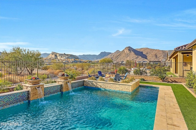 view of swimming pool featuring a mountain view, a patio area, and pool water feature