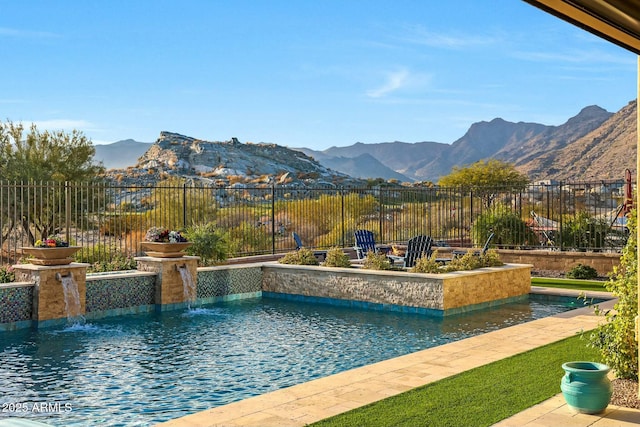 view of pool featuring pool water feature and a mountain view