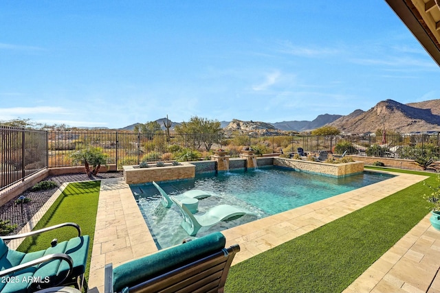 view of pool with a mountain view and pool water feature