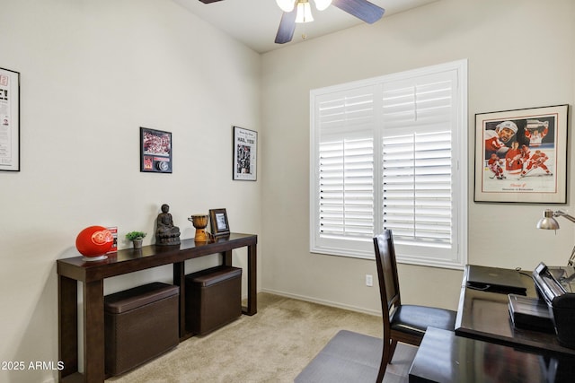 home office featuring carpet floors, baseboards, and ceiling fan