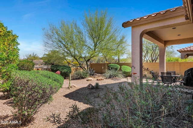 view of yard with a fenced backyard and a patio area