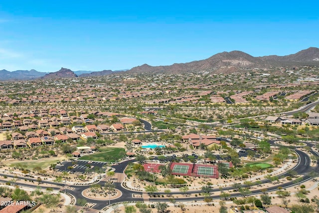 birds eye view of property with a mountain view