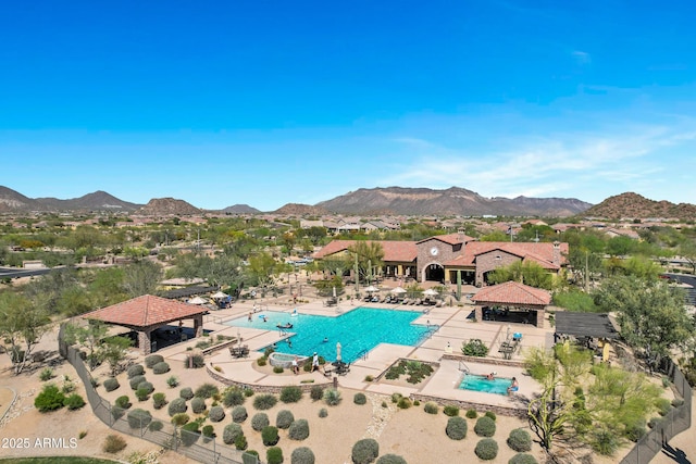 community pool featuring a gazebo, a mountain view, and a patio area