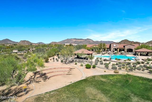 outdoor pool with a yard, a gazebo, and a mountain view