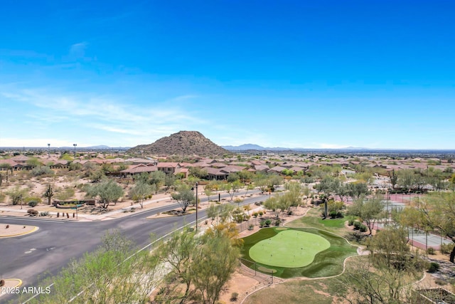 view of mountain feature with golf course view and a residential view