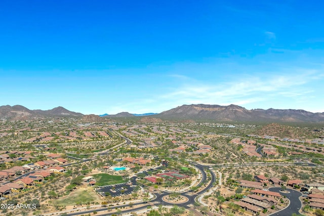 birds eye view of property with a mountain view